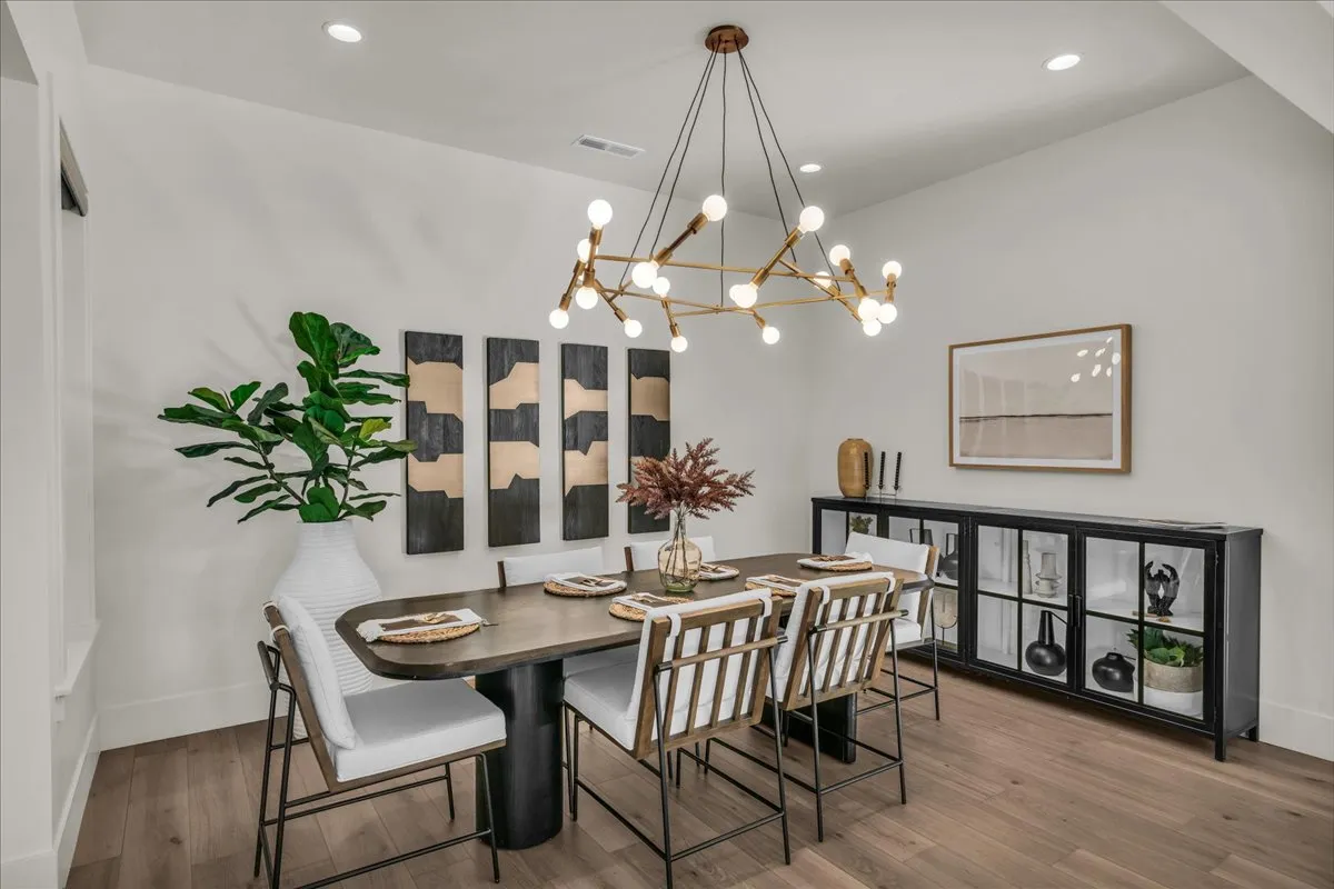 Elegant dining area with designer lighting